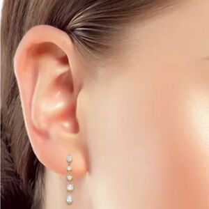 BRAND NEW crystal dangle earrings from Bloomingdale’s 14k Gold over silver.